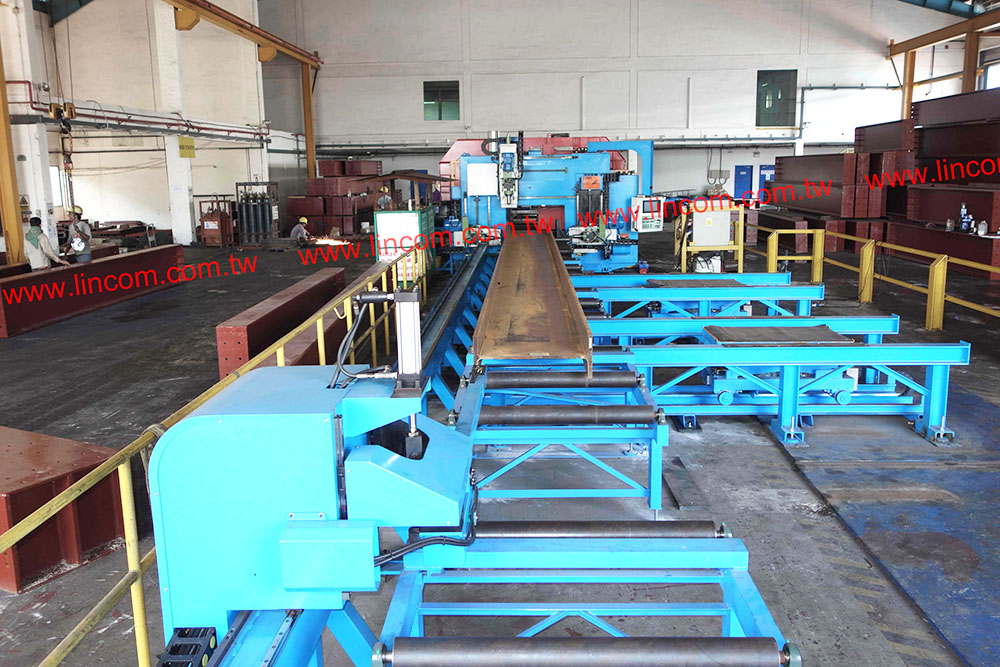 CNC h beam drilling machine, with robot system adaptation for production automation.