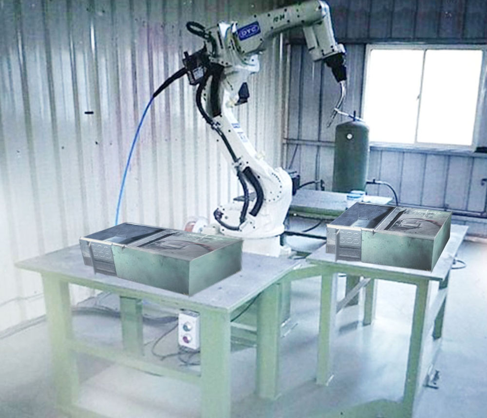 Robot welding with digital control program for fire hose cabinet manufacturing with table and fixture.