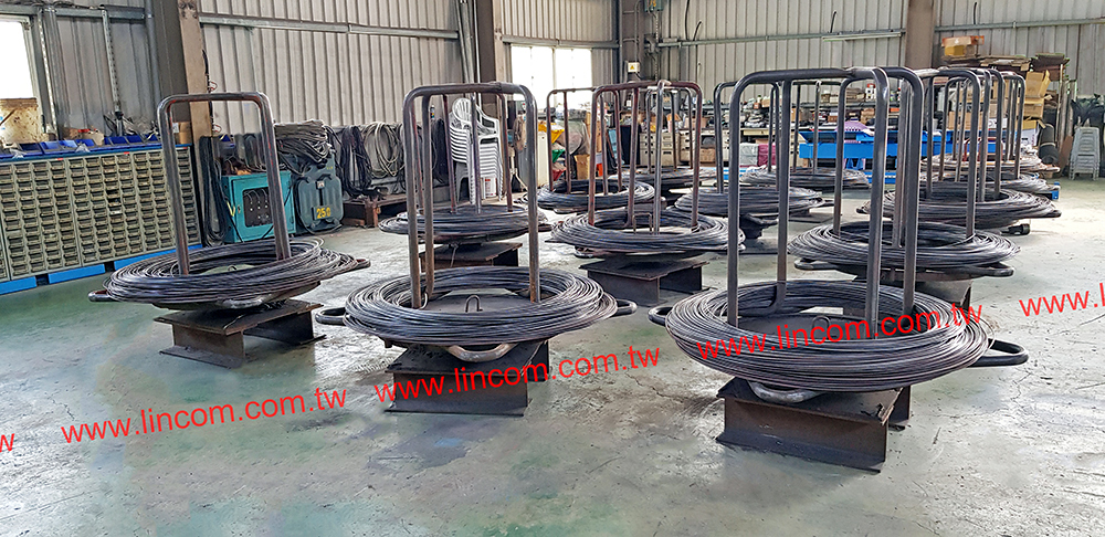 Wire coil stand for wire mesh welder wire feeding system.